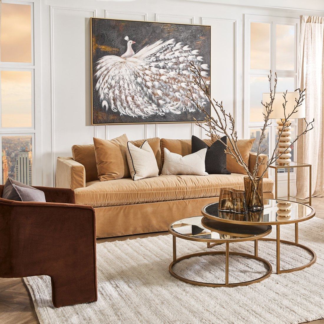 The Birkshire slip cover sofa in Ochre Velvet in a styled living room