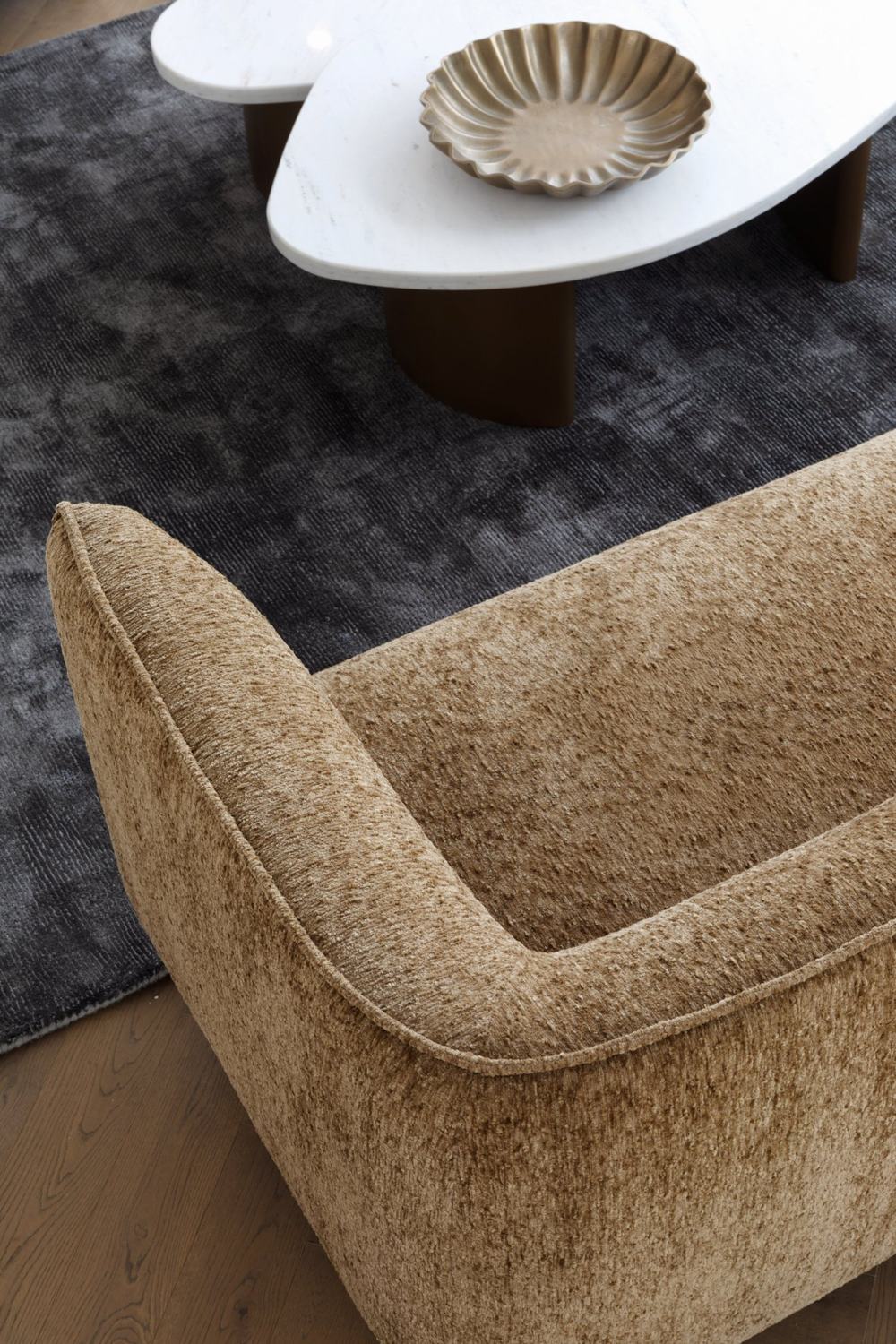 A close up of soft bronze boucle upholstery