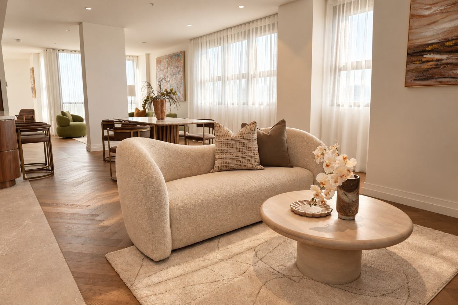 Aurora in Off White, styled in a light-filled living room beside a round timber coffee table