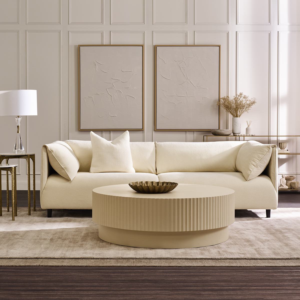 The Dominic sofa in Ivory with a round fluted coffee table